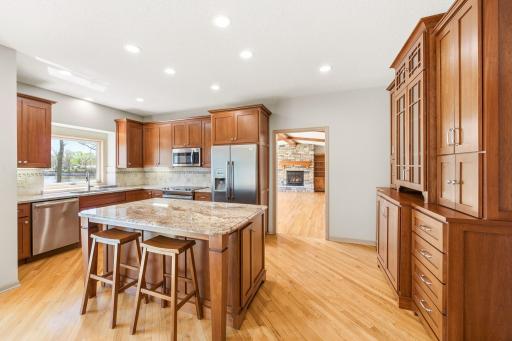 Stunning cherry cabinetry with granite countertops.