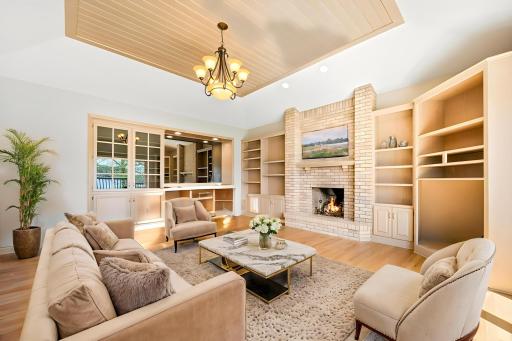 Main floor family room with wet bar and built in wine fridge. Photo is virtually staged.