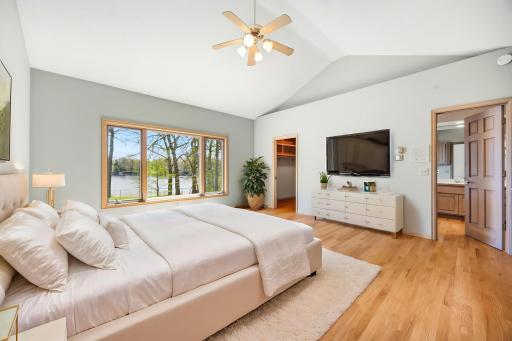 Primary suite features walk-in closet and private bathroom. Photo is virtually staged.