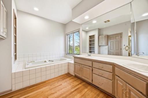 Primary bath includes a jetted tub and river views.