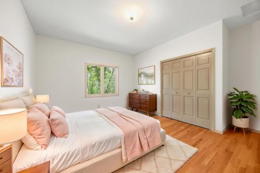 Oversized main floor bedrooms. 3 beds on one level with hardwood floors and solid doors. Photo is virtually staged.
