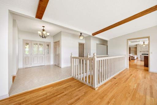Spacious entry with large closet, tiled and hardwood flooring.