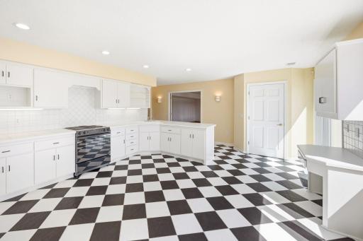 Tiled flooring from the poolside patio door through the kitchen and to the full bathroom for easy in and out.