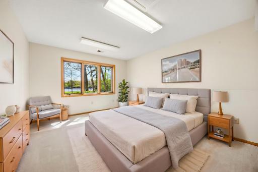 4th bedroom in lower level with connecting 3/4 bathroom. Perfect Mother In Law suite. Photo is virtually staged.
