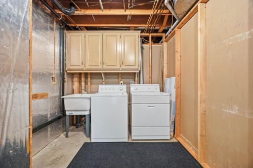 Lower level laundry room with dual access for the entire lower and for the MIL apartment.