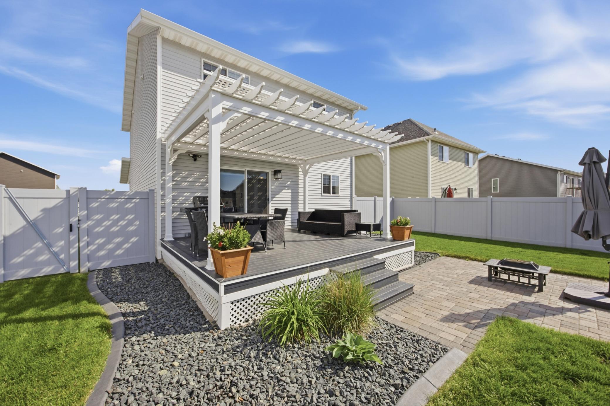 Deck with pergola and paver patio