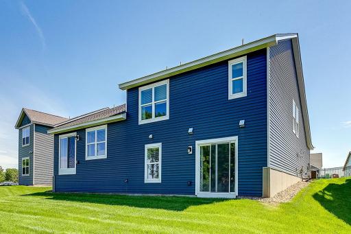 The Finnegan rear view of walkout lower level at Highlands at Eagle View in Elko New Market. Photo is of a similar home. Options and colors may vary. Ask Sales Agent for details.