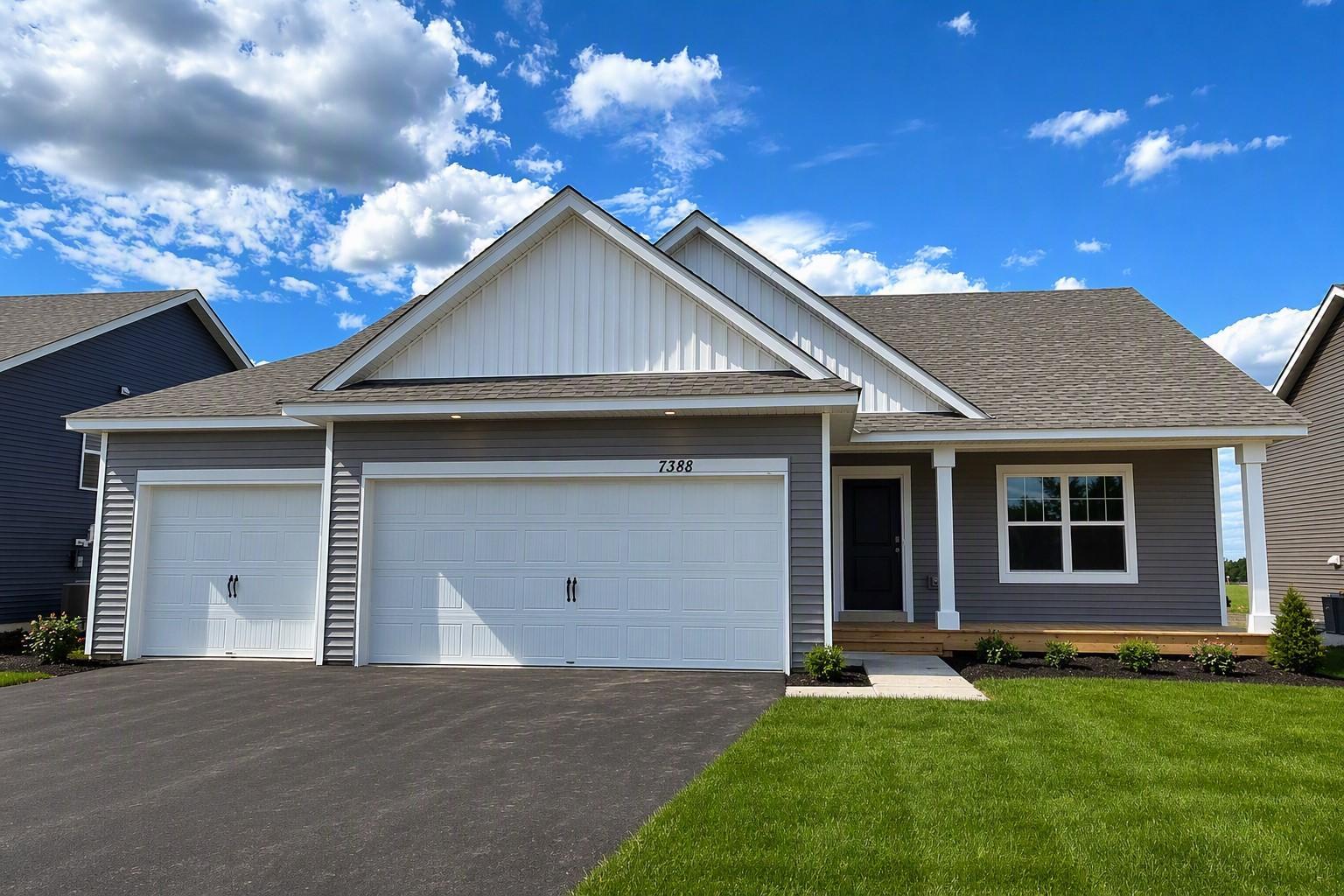 The Finnegan Heartland Cottage at Highlands at Eagle View in Elko New Market. Photo is of actual home. Options and colors may vary. Ask Sales Agent for details. AI-generated landscaping for visualization. Actual yard condition may differ.