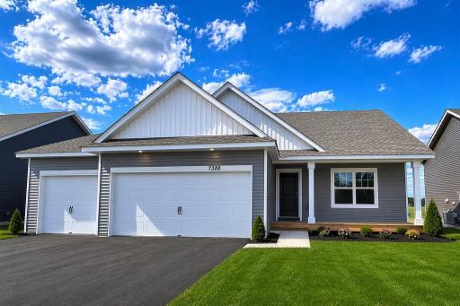 The Finnegan Heartland Cottage at Highlands at Eagle View in Elko New Market. Photo is of actual home. Options and colors may vary. Ask Sales Agent for details. AI-generated landscaping for visualization. Actual yard condition may differ.