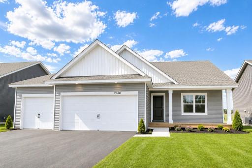 The Finnegan Heartland Cottage at Highlands at Eagle View in Elko New Market. Photo is of actual home. Options and colors may vary. Ask Sales Agent for details. AI-generated landscaping for visualization. Actual yard condition may differ.