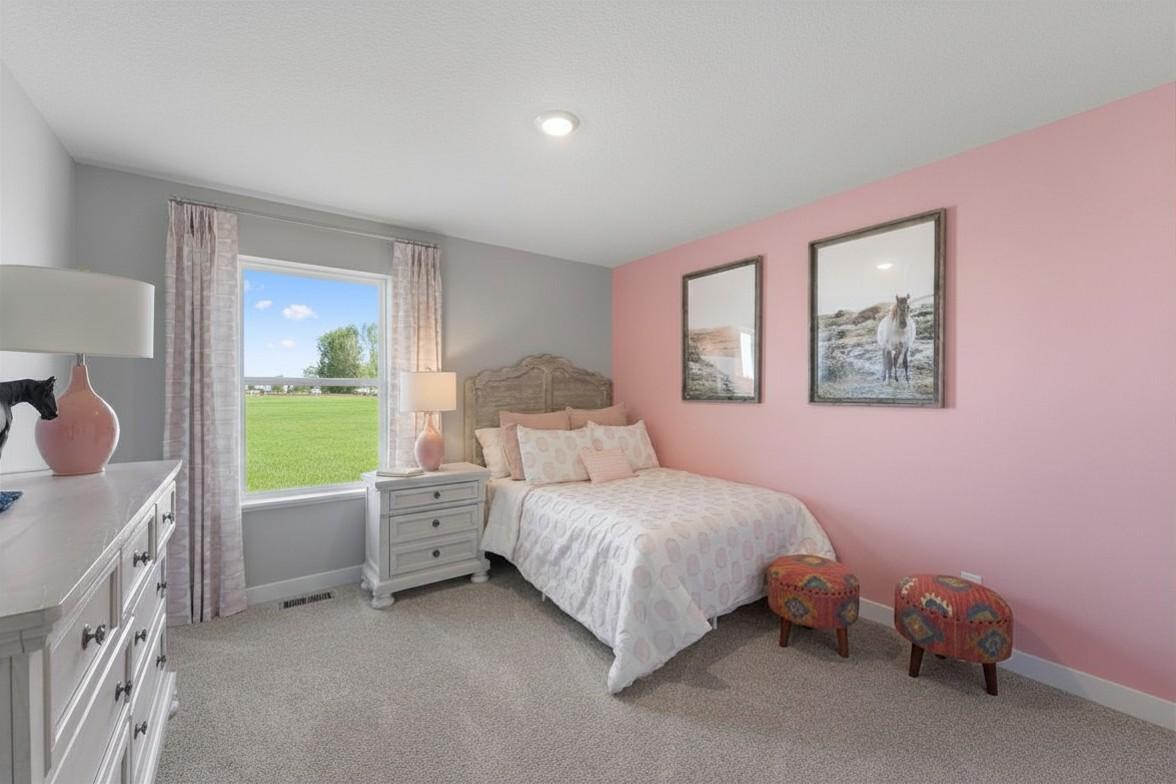 Bedroom #3 with lots of natural light. Photo is of model home. Colors and options may vary. Ask Sales Agent for details.