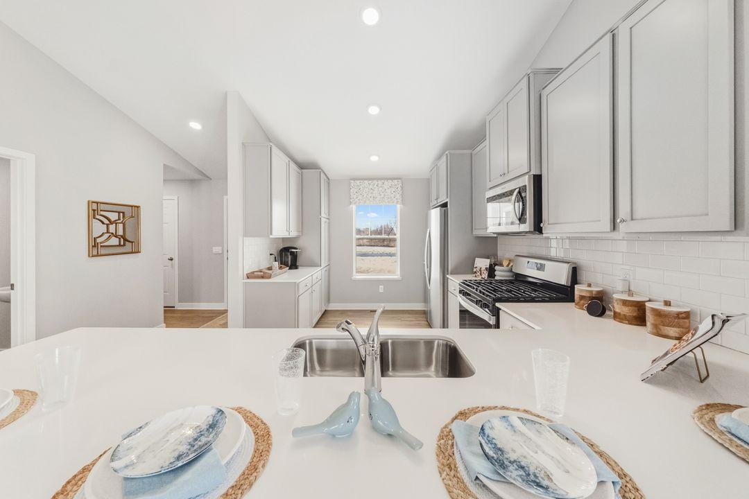 The Bryant II kitchen at Highlands at Eagle View in Elko New Market. Photo is of model home. Options and colors may vary. Ask Sales Agent for details.