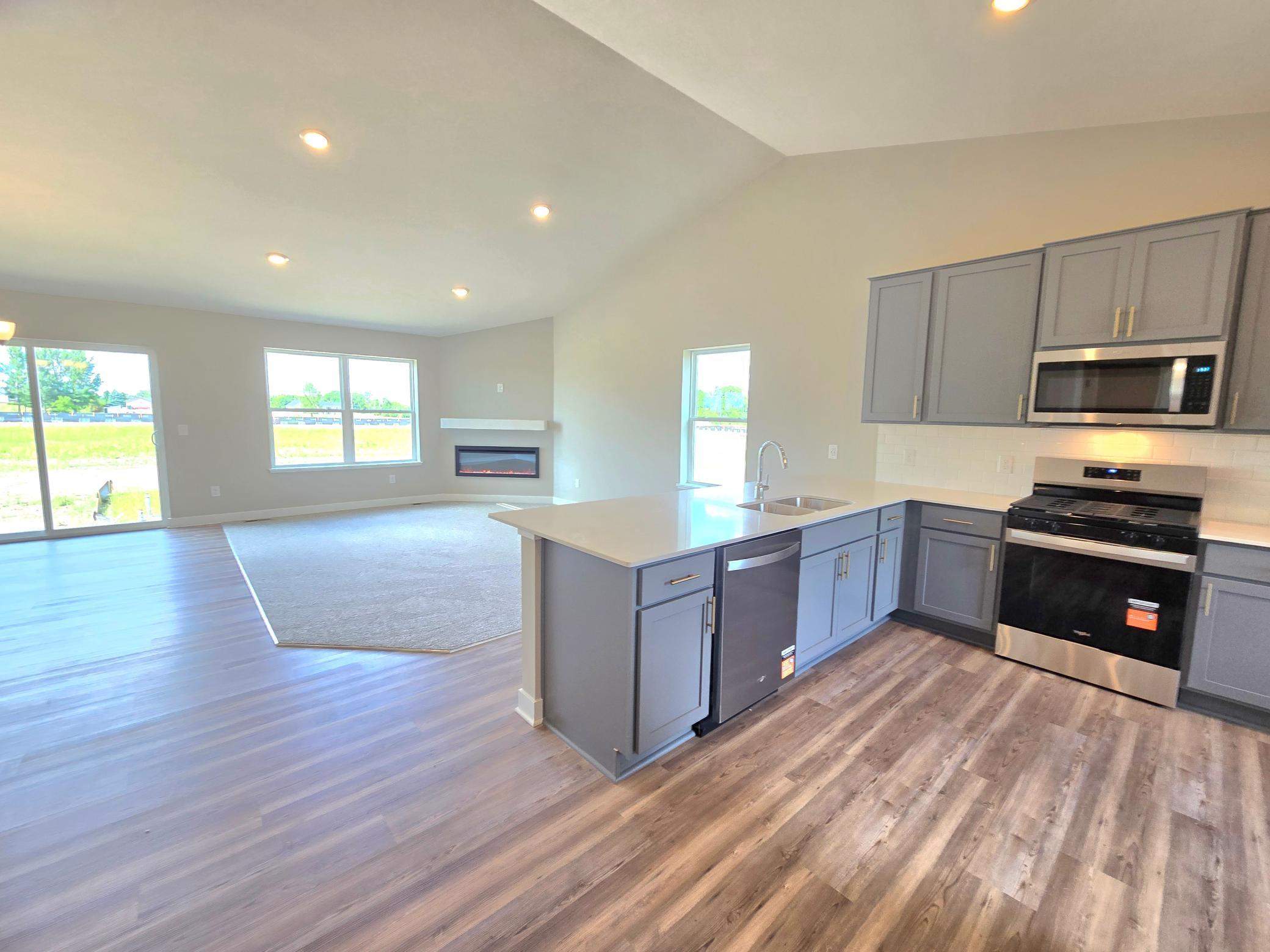 The Bryant II Kitchen shown with Harbor Gray cabinets at Highlands at Eagle View in Elko New Market. Photo is of actual home. Options and colors may vary. Ask Sales Agent for details.