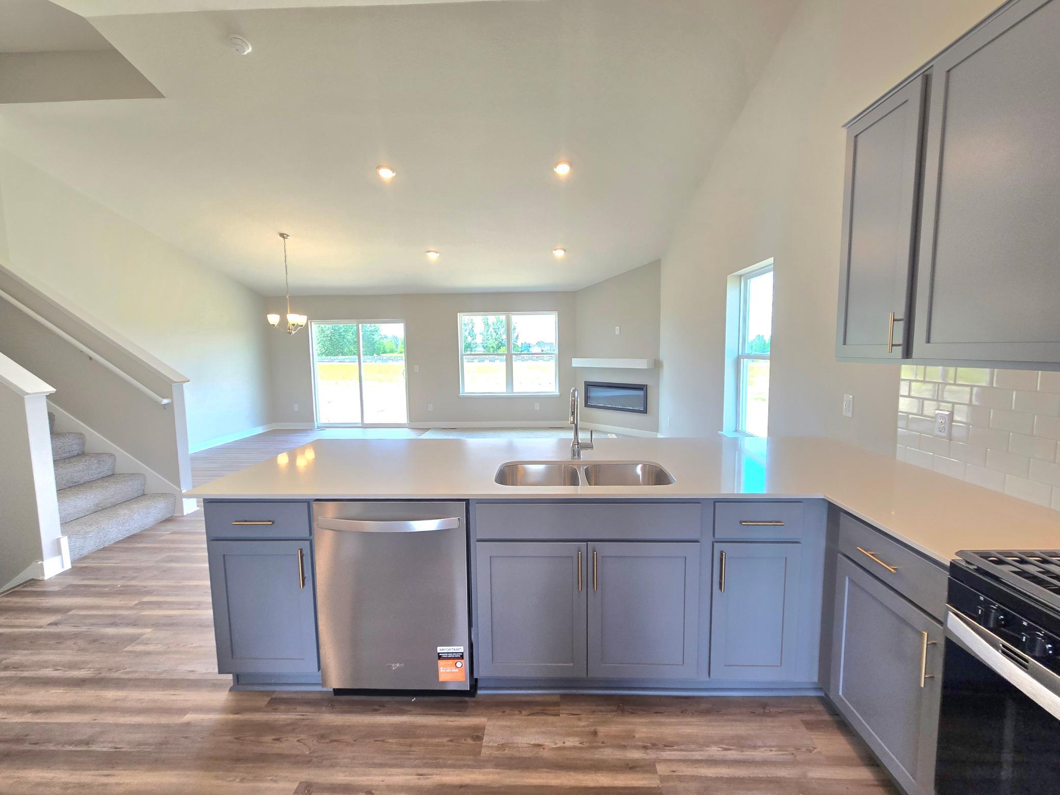The Bryant II Kitchen shown with Harbor Gray cabinets at Highlands at Eagle View in Elko New Market. Photo is of actual home. Options and colors may vary. Ask Sales Agent for details.