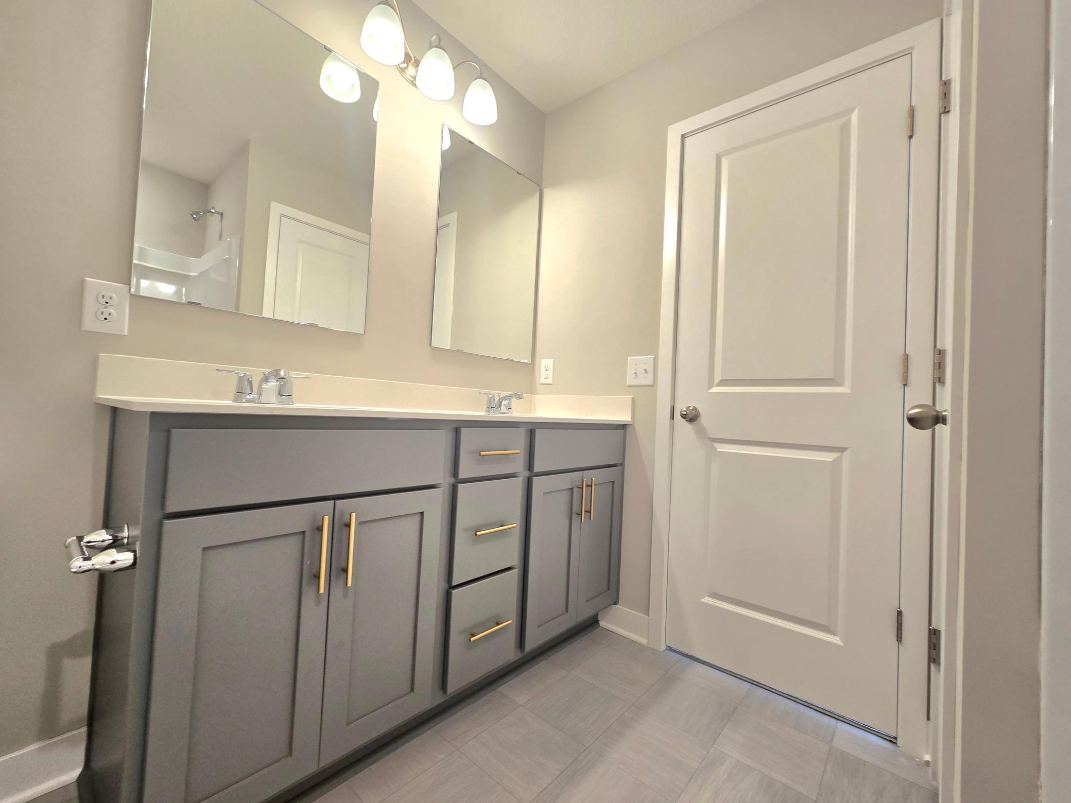 The Bryant II Primary Bathroom shown with Harbor Gray cabinets at Highlands at Eagle View in Elko New Market. Photo is of actual home. Options and colors may vary. Ask Sales Agent for details.