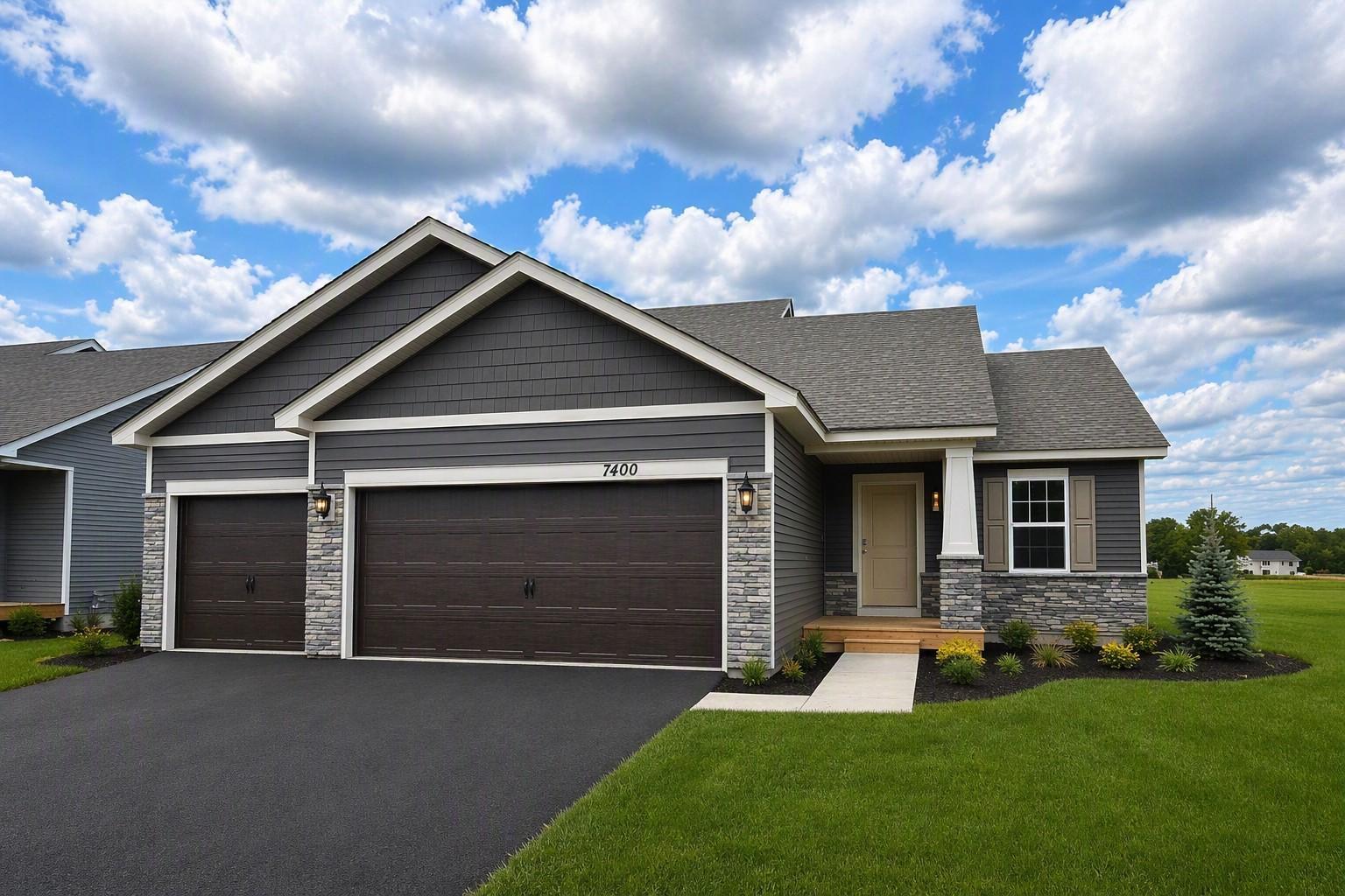 The Bryant II Northern Craftsman at Highlands at Eagle View in Elko New Market. Photo is of a actual home. Options and colors may vary. Ask Sales Agent for details. AI-generated landscaping for visualization. Actual yard condition may differ.