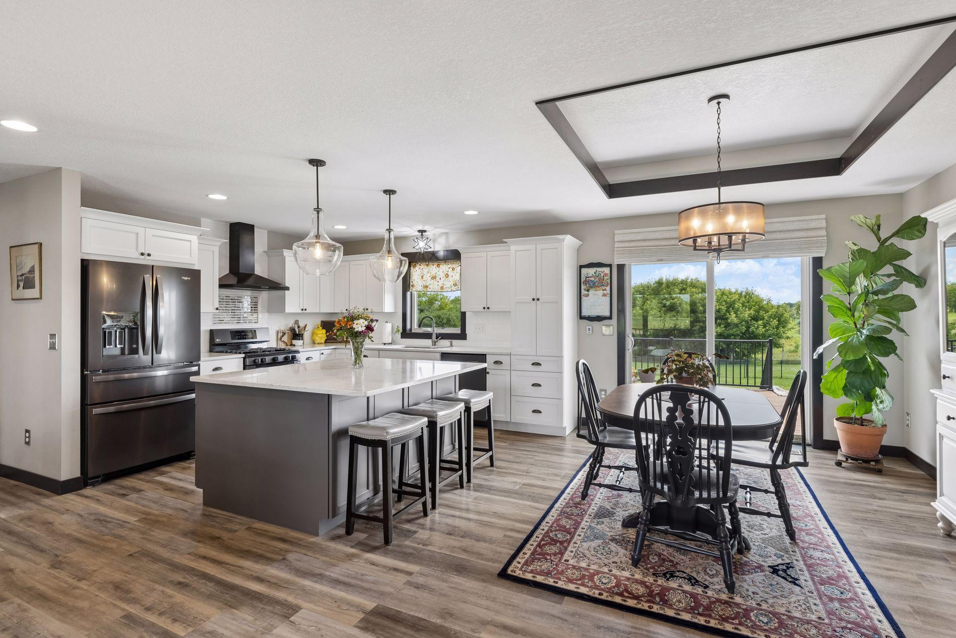 Kitchen and dining room flow effortlessly to the back deck