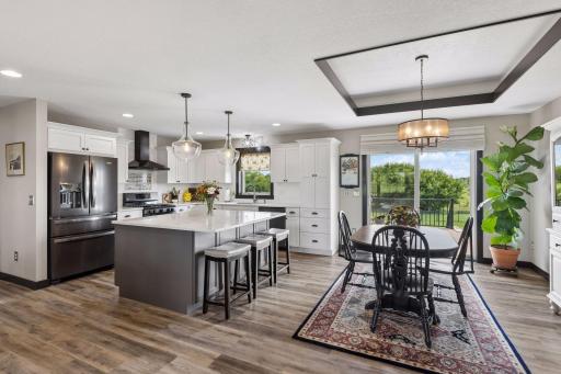 Kitchen and dining room flow effortlessly to the back deck