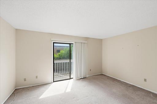 Living room with access to the back balcony.