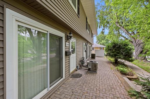 Cute all brick patio out the front door and sliding glass door in the dining room.