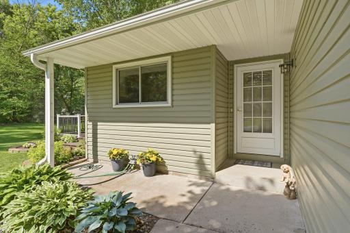 The covered entry way and front patio area is perfect for greeting visitors.
