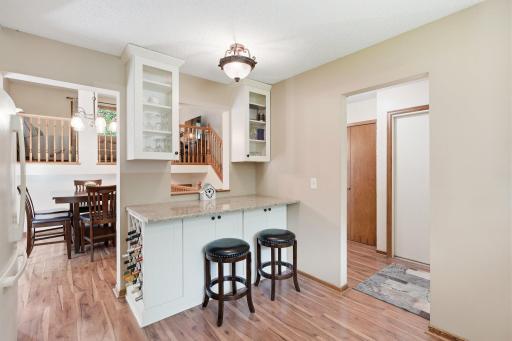 Built in wine rack in the breakfast nook area. Notice the glass doors on the upper cabinets.