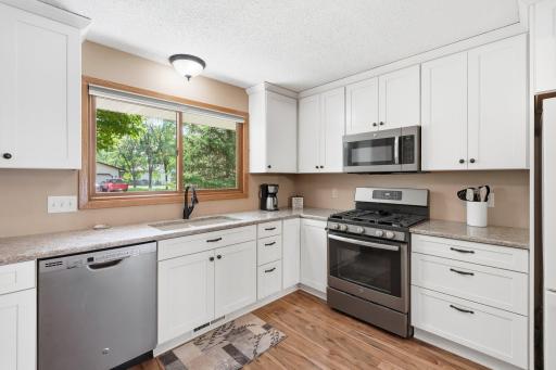 The large kitchen window is perfect for letting so much sunlight flow into the room.