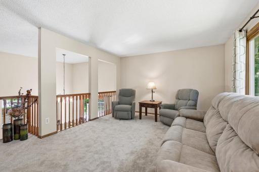 On the upper level of the home is the large formal living room plus 2 bedrooms and a full bath. Brand new carpet through the entire upper level of the home.