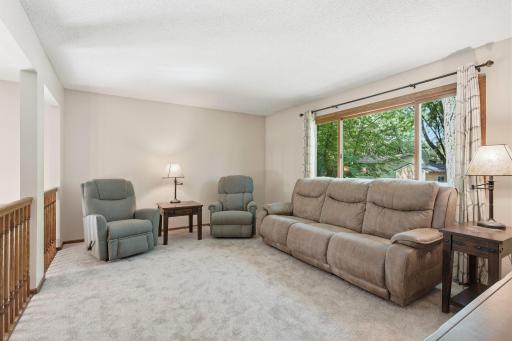 Plenty of seating space in the large formal living room on the upper level and the huge picture window overlooks the backyard. The entire upper level has brand new carpet.
