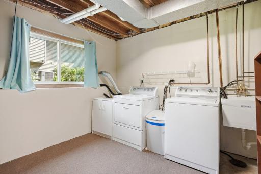 Large laundry room area in the lower level and note the large window which lets in plenty of sunlight.