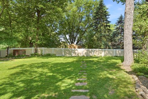 Maintenance free fence along the backside of the property.