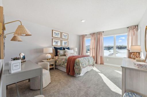One of the MASSIVE 4 bedrooms on the upper level. Look at the space and those windows.