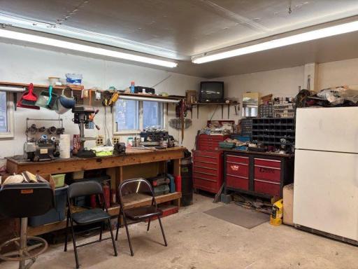 Built in work bench and refrigerator come with the building