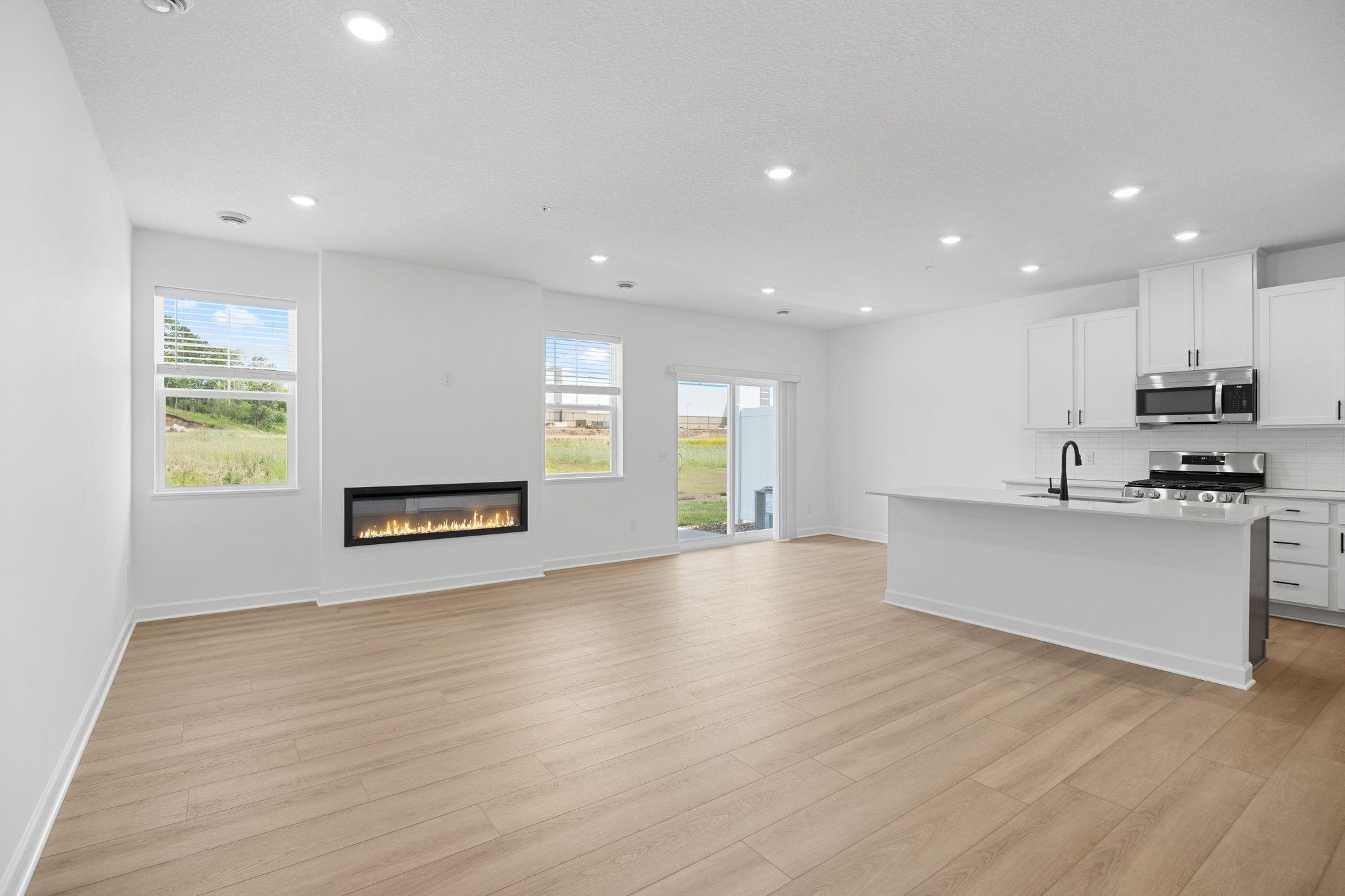 This Great Room is framed by windows to bathe the space in natural light