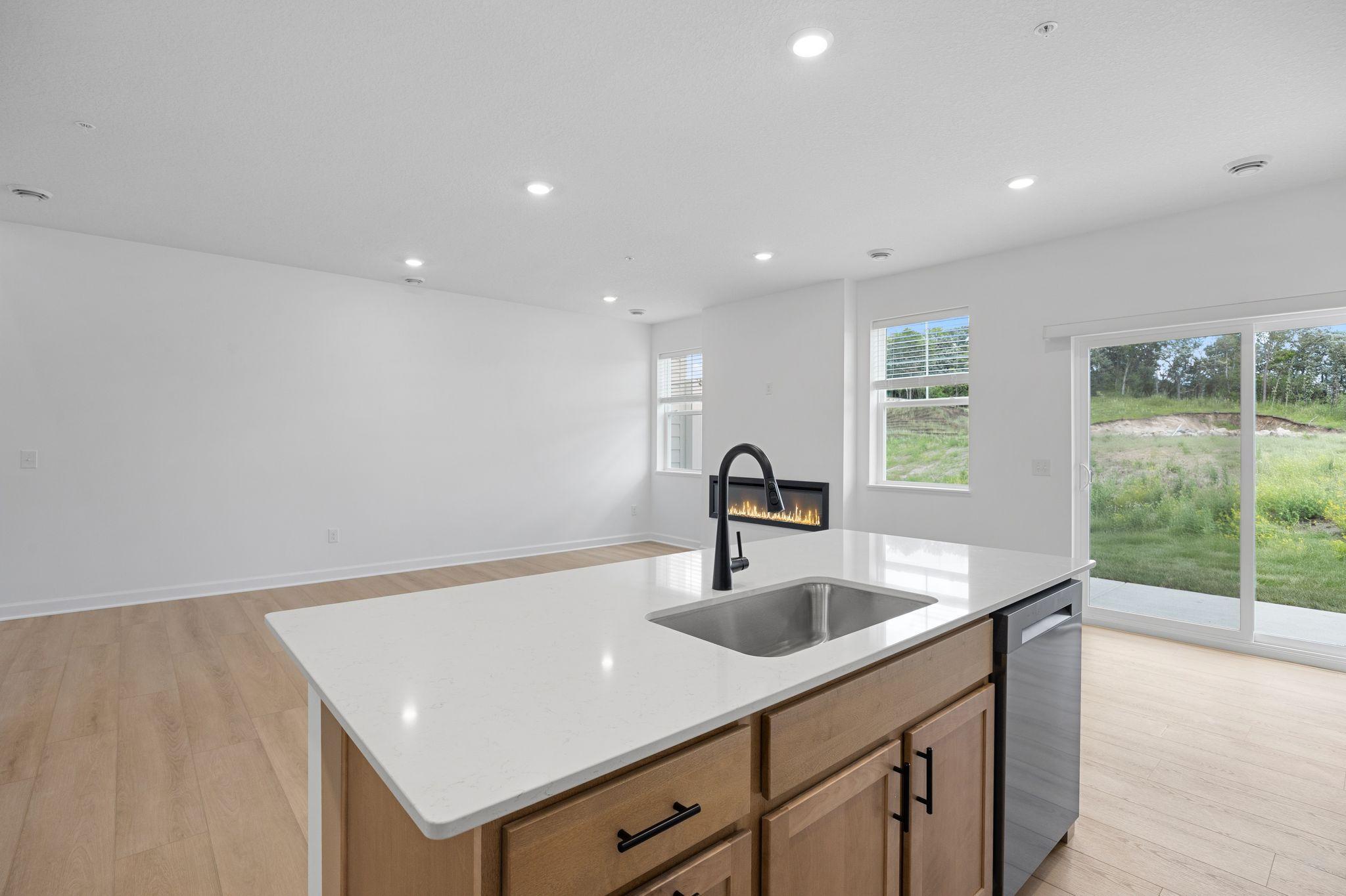 This center island includes a stainless steel sink with designer faucet to remove stubborn stains