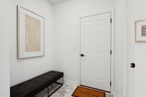 (Photo of a decorated model, actual homes finishes will vary) The mudroom.
