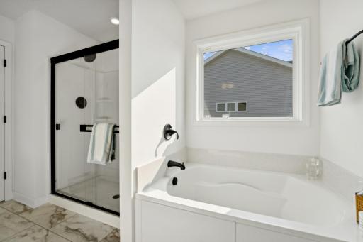 (Photo of a decorated model, actual homes finishes will vary) Another view of the primary bath.