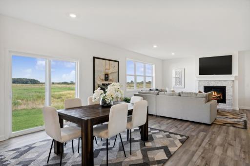 (Photo of a decorated model, actual homes finishes will vary) The dining area.