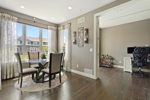 Dining area with bay window, view into main level office