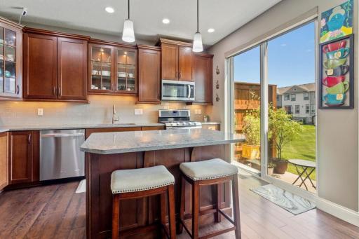 Recessed lighting, quartz counters, tiled back splash