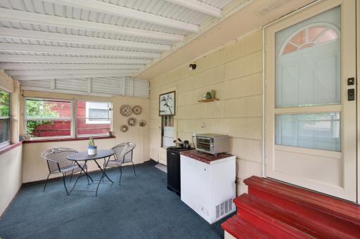 Screened in porch off dining room, main level.