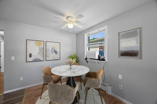 Unit 1 - Dining room with easy access to both the kitchen and living room.
