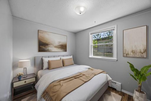 Unit 2 - Second bedroom featuring side yard views.
