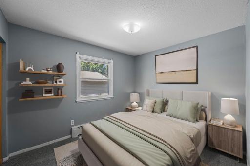 Unit 3 - Second bedroom featuring side yard views.