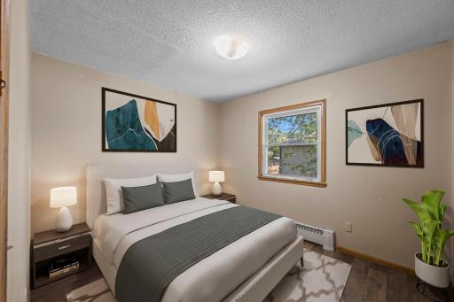 Unit 4 - Secondary bedroom featuring peaceful side views.