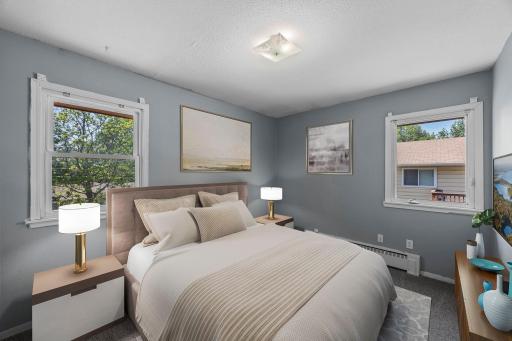 Unit 3 - Primary bedroom featuring peaceful backyard and side yard views.