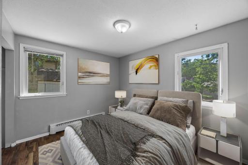 Unit 2 - Primary bedroom with views of both the side and backyard.