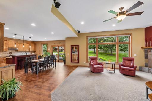 Designed for both everyday life and entertaining, the spacious great room offers beautiful backyard views, abundant natural light, and seamless connection to the kitchen and dining spaces.