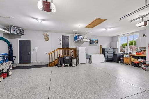 Substantially larger than a typical 3 car garage. Enjoy abundant workspace in this clean garage space with service door to the backyard.
