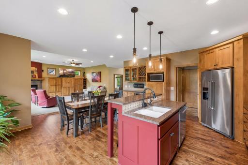 Warm finishes, extensive cabinetry, and convenient contrasting center island